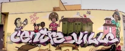 Mural de grafite colorido com a palavra Centre-Ville e moradores pintados